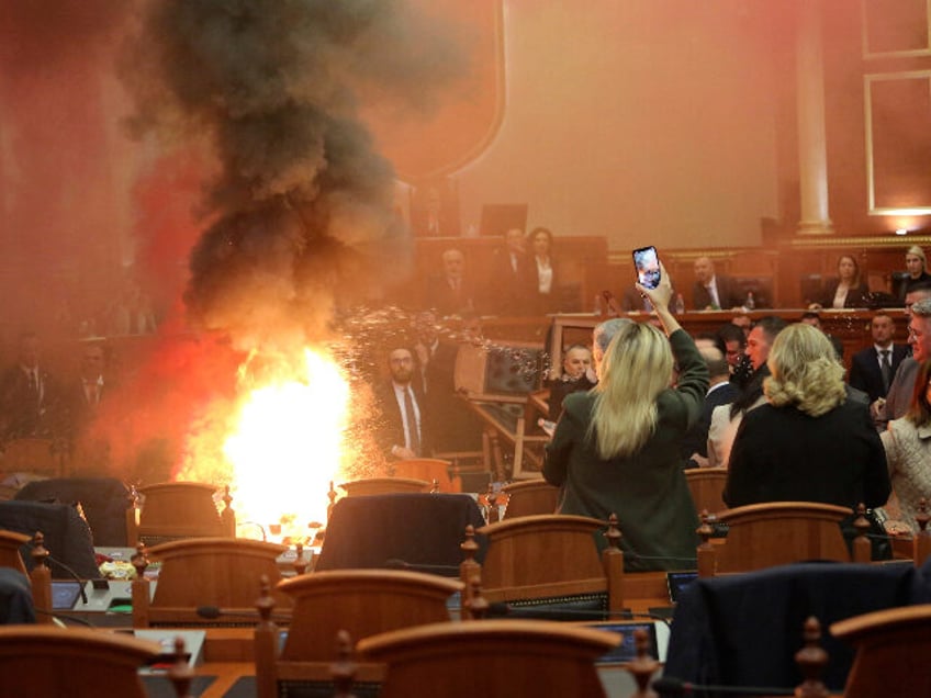 albania opposition starts fire in parliament during anti government protest