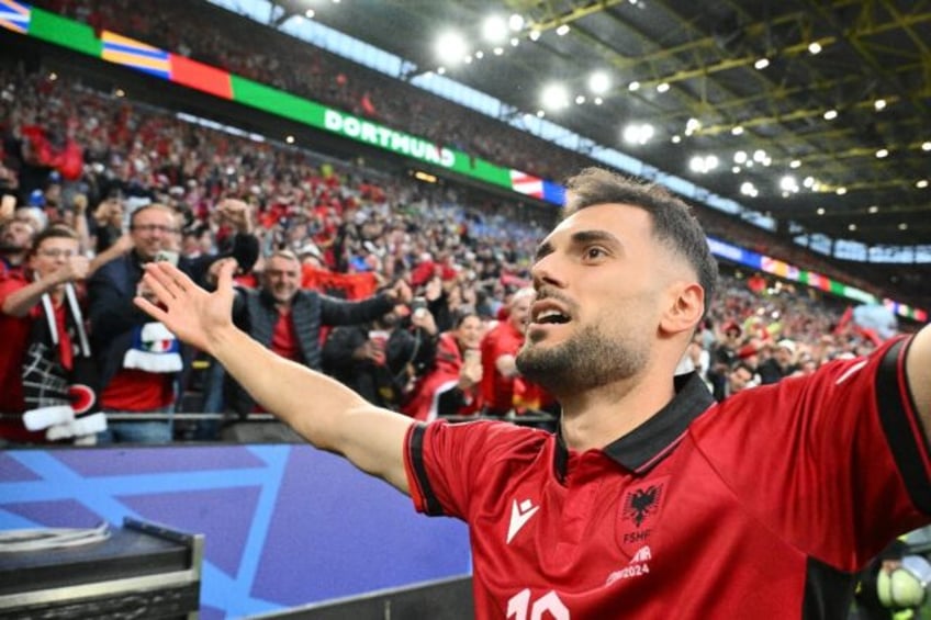 Nedim Bajrami celebrates after putting Albania ahead against Italy with the fastest ever g