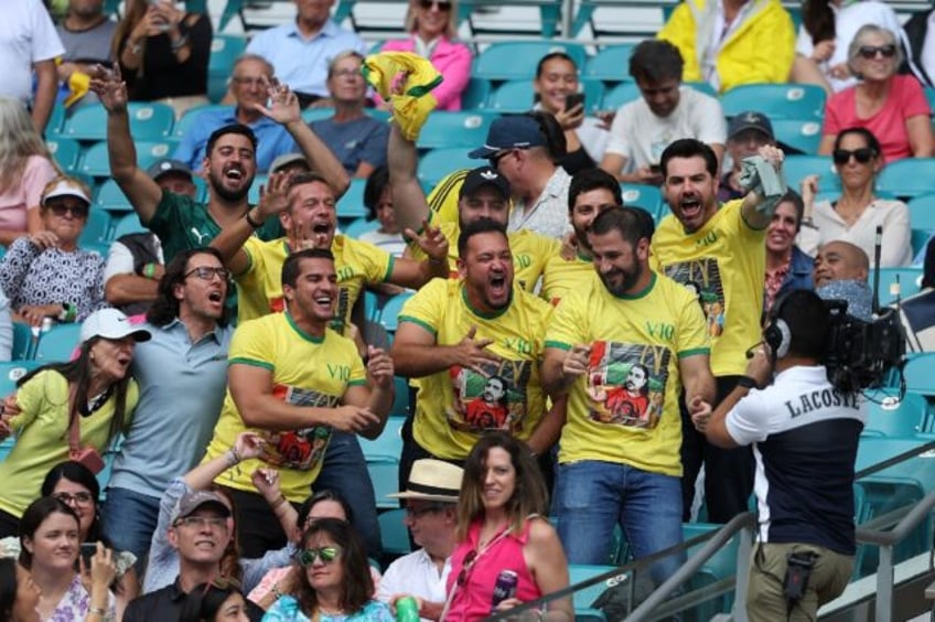 Fans of Thiago Seyboth Wild of Brazil cheer during the match against Taylor Fritz at the M