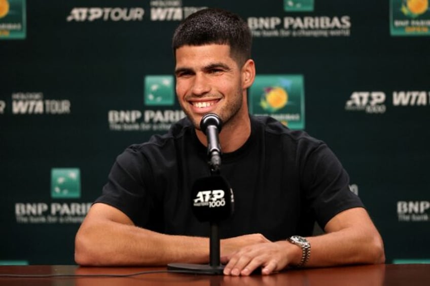Spain's Carlos Alcaraz talks to reporters ahead of his ATP title defense at the BNP Pariba