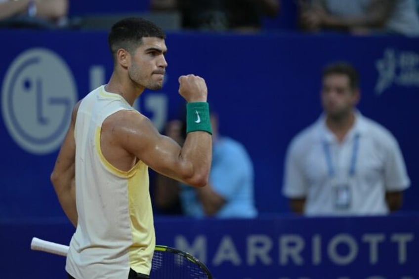 Power-packed: Carlos Alcaraz celebrates after winning a point