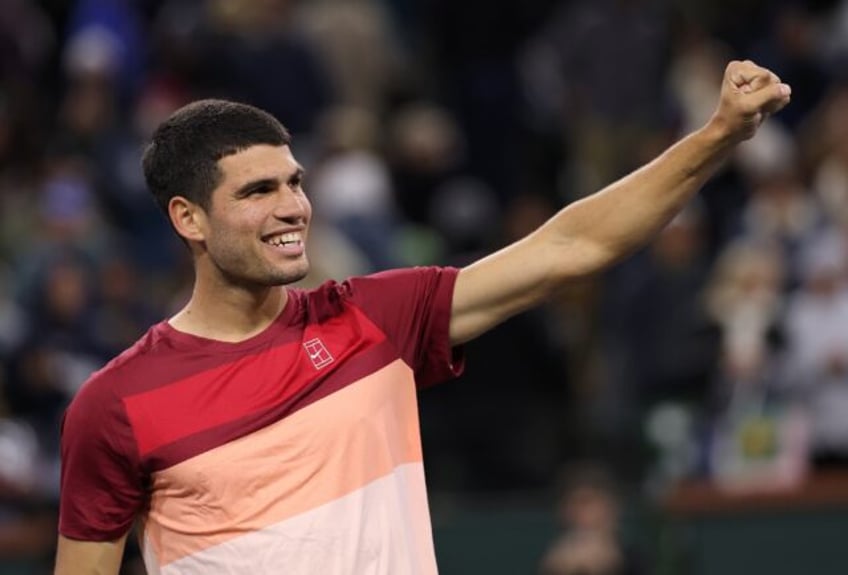 Two-time defending champion Carlos Alcaraz of Spain celebrates his quarter-final victory o