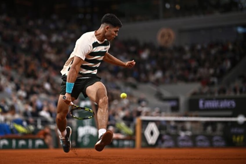 Carlos Alcaraz earned an entertaining win against Fabian Marozsan under the roof on Court