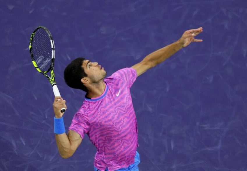 Spain's Carlos Alcaraz serves on the way to a second-round victory over Matteo Arnaldi of