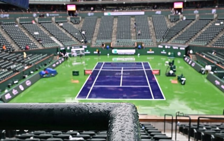 Seats are pictured empty during the rain delay that disrupted the semi-final between Carlo