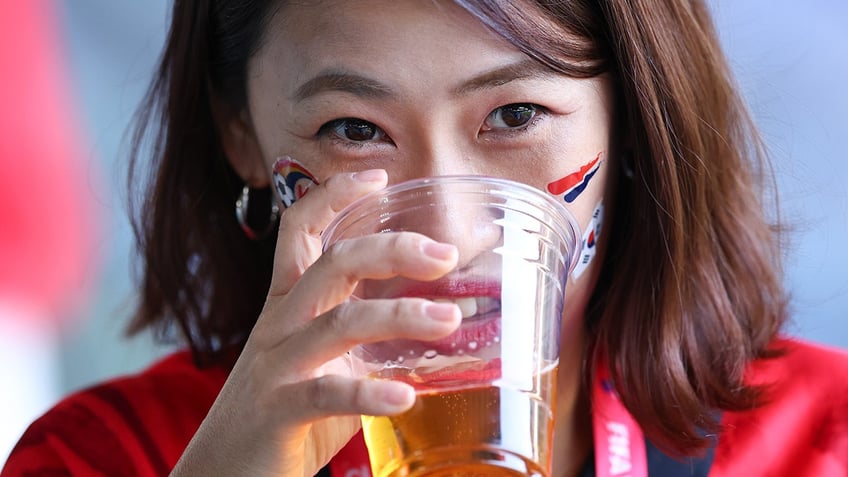 Woman drinking beer