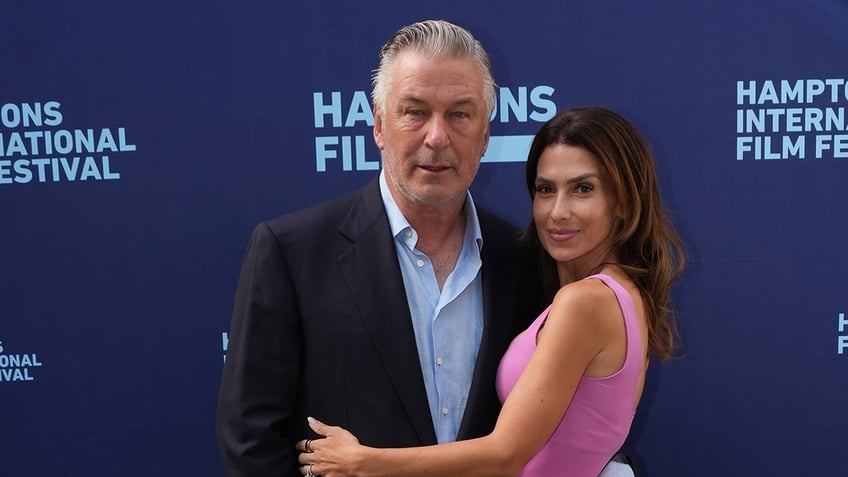 Alec Baldwin and Hilaria Baldwin posing on red carpet