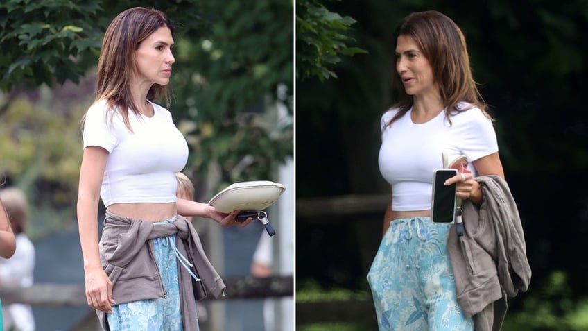 Yogi Hilaria Baldwin flashes her abs in crop top and slacks.