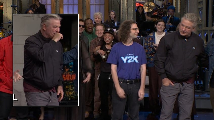 Actor Alec Baldwin wears black jacket and slacks on Saturday Night Live.