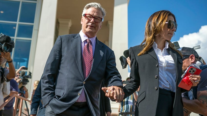 Alec Baldwin and his wife Hilaria Baldwin leave District Court