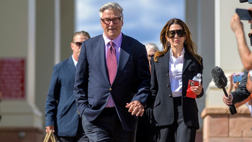 Alec Baldwin and his wife Hilaria Baldwin leave District Court