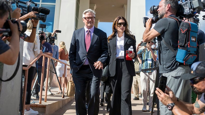 Alec Baldwin and his wife Hilaria Baldwin leave District Court