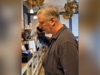 Alec Baldwin smacks phone of anti-Israel agitator who begged him to say 'Free Palestine' inside coffee shop