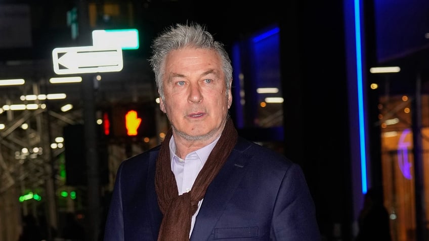 Alec Baldwin wraps scarf around his neck in New York.