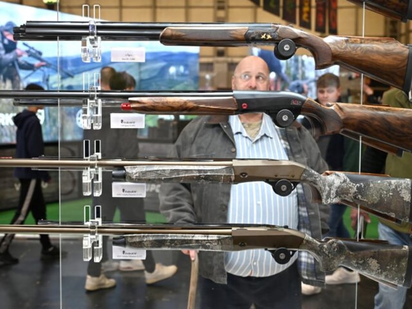 BIRMINGHAM, ENGLAND - FEBRUARY 23: Visitors view Fabarm shotguns and rifles during The Bri