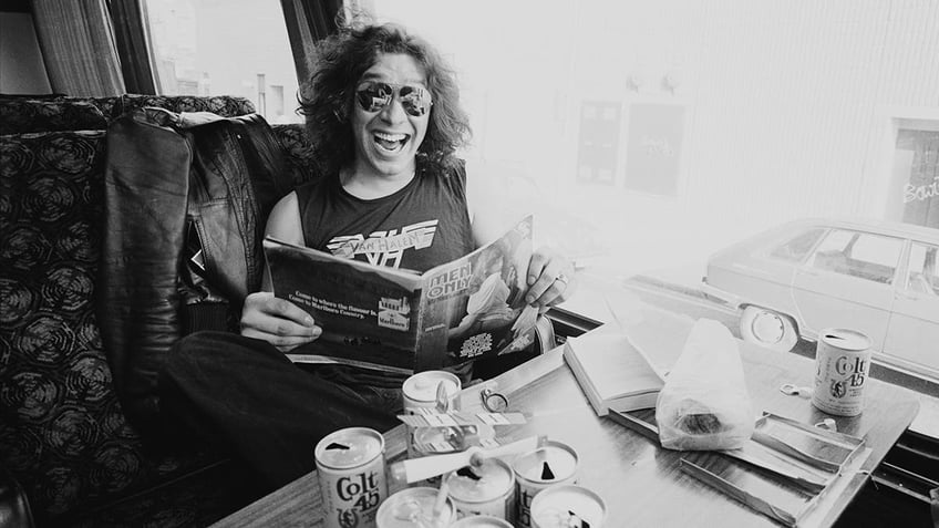 Alex Van Halen in the late '70s with several empty cans of beer