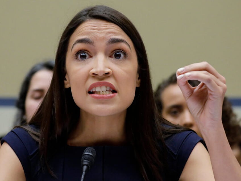 In this Friday, July 12, 2019, file photo, Rep. Alexandria Ocasio-Cortez, D-NY., gestures