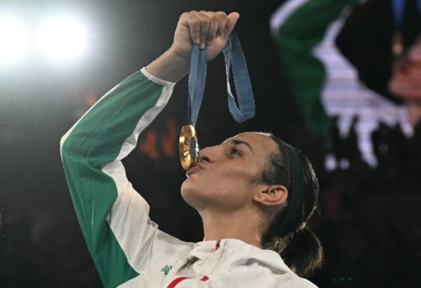 Algerian boxer Imane Khelif celebrates winning gold at the 2024 Olympics in Paris