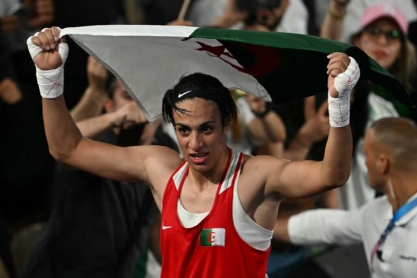 Algeria's Imane Khelif reacts after beating China's Yang Liu in the women's 66kg final