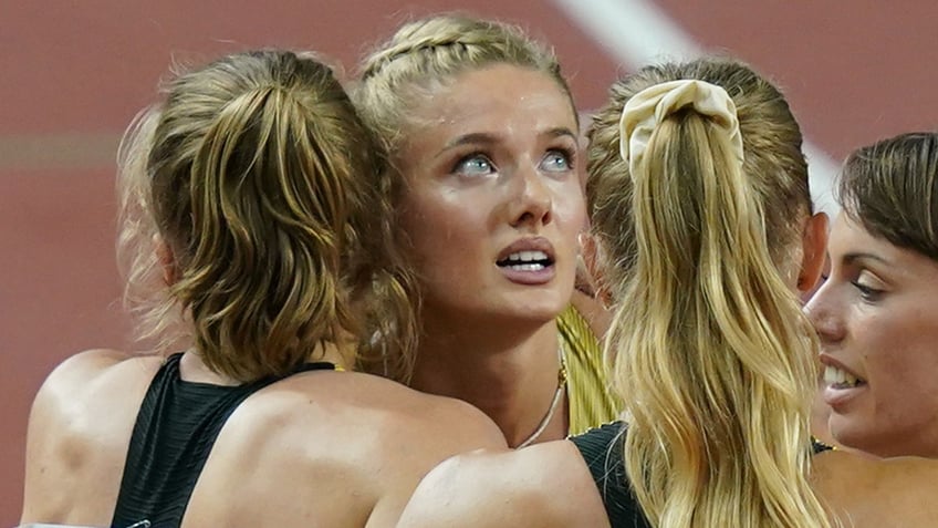 Germany track athletes embrace