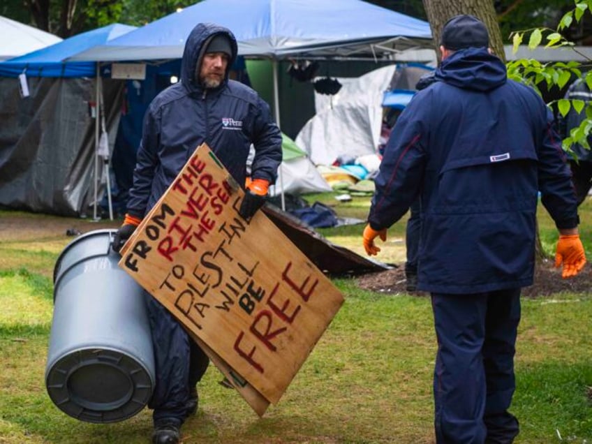 Maintenance staff and waste disposal crews clean up after police cleared a pro-Palestinian