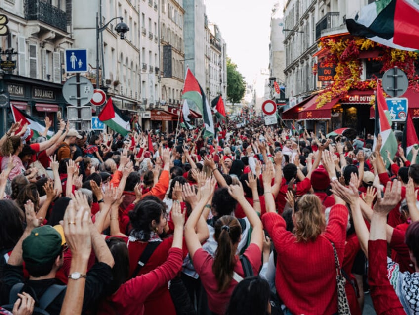 Demonstrators take part in a ''human red line'' protest, organized by non-governmental org