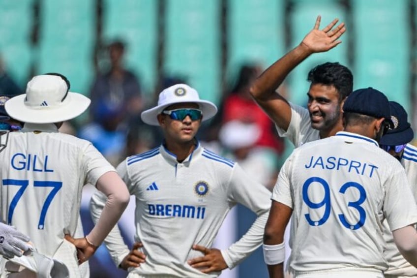 India's Ravichandran Ashwin celebrates after taking the wicket of England's Zak Crawley, h