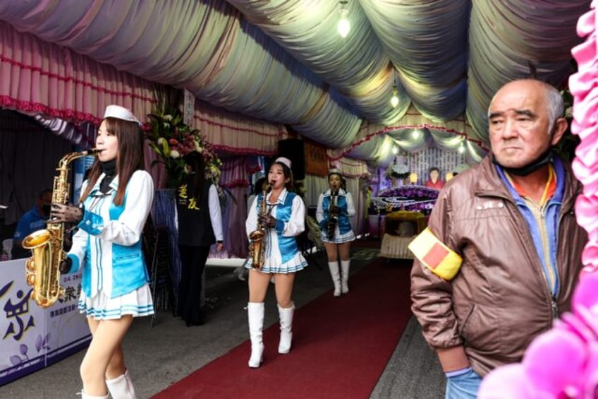 Da Zhong women's group is part of a long tradition of funeral marching bands performing in