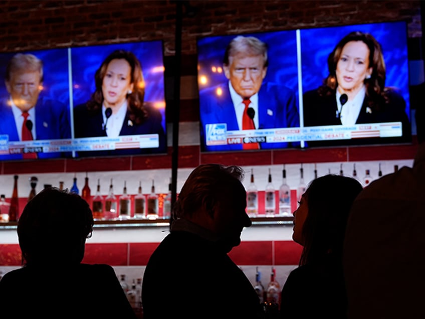 Viewers gather to watch a debate between Democratic presidential nominee Vice President Kamala Harris and Republican presidential nominee former President Donald Trump at the Angry Elephant Bar and Grill, Tuesday, Sept. 10, 2024, in San Antonio. (AP Photo/Eric Gay)