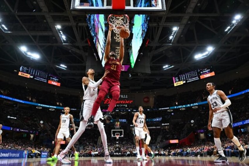 Cleveland's Jarrett Allen dunks over Victor Wembanyama of the San Antonio Spurs in the Cavaliers' NBA victory over the Spurs