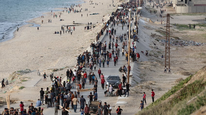 An aerial view of the Gaza Pier, where a large crowd of Palestinians have gathered 