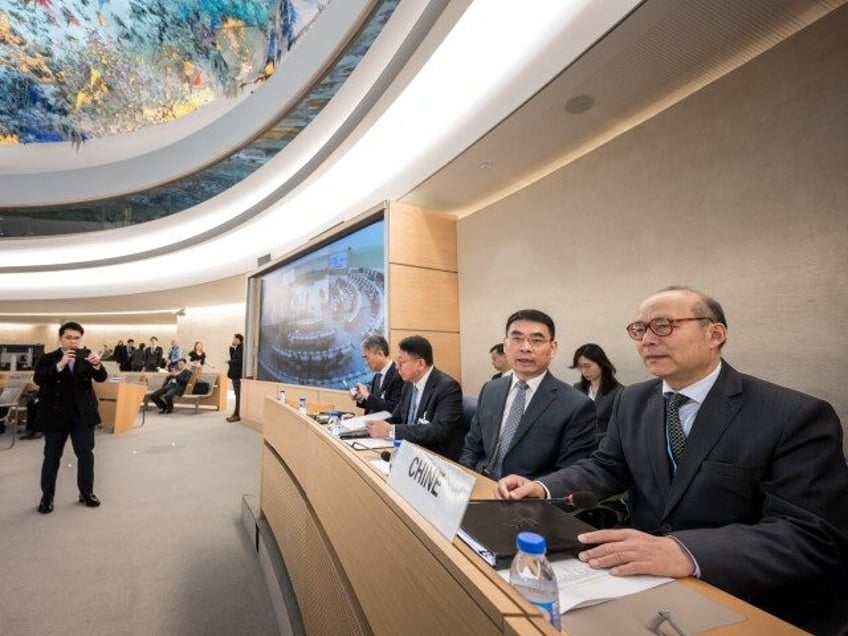 Heads the Chinese Mission to the UN in Geneva Chen Xu (R) sits with a file prior to the review of China's rights record by the United Nations Human Rights Council in Geneva, on January 23, 2024. A civil liberties crackdown, repression in Xinjiang and Hong Kong's draconian national security …