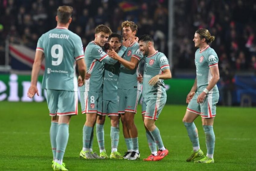 Atletico Madrid players celebrate the second goal in their 6-0 win at Sparta Prague