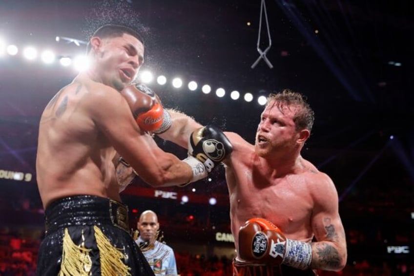 Saul 'Canelo' Alvarez lands a punch on the way to a unanimous decision victory over Edger