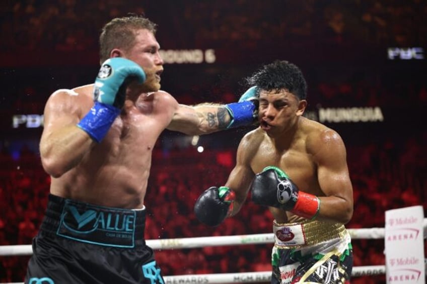 Saul 'Canelo' Alvarez lands a left against Jaime Munguia on the way to a unanimous decisio