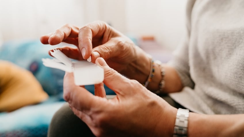 Woman taking pills