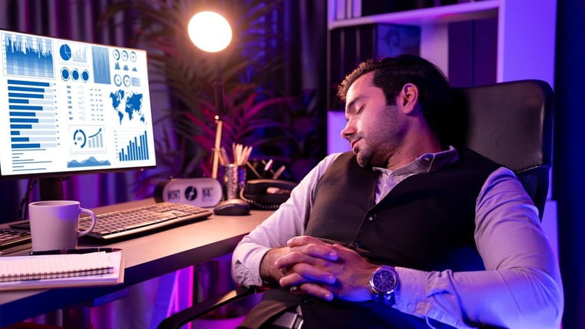 Man sleeping at computer