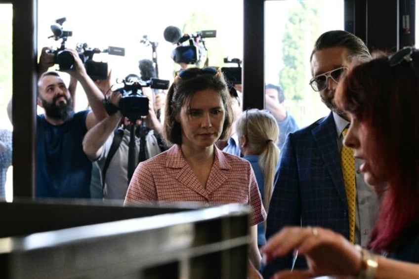 Amanda Knox arrives with her husband Christopher Robinson at the courthouse in Florence, o