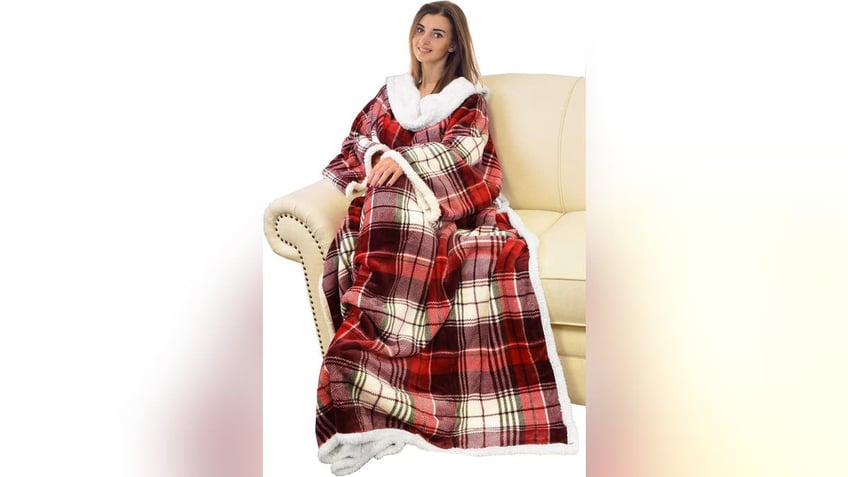 A wearable blanket makes it easy to move around the couch without ever taking off your blanket. 