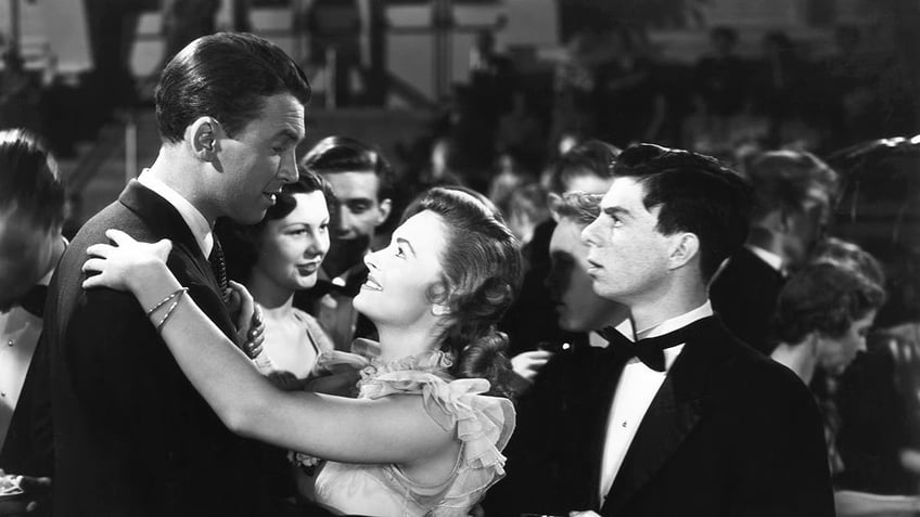 Carl Switzer looking at James Stewart dancing with Donna Reed in It's a Wonderful Life