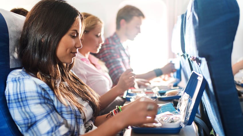 flight passenger eating meal