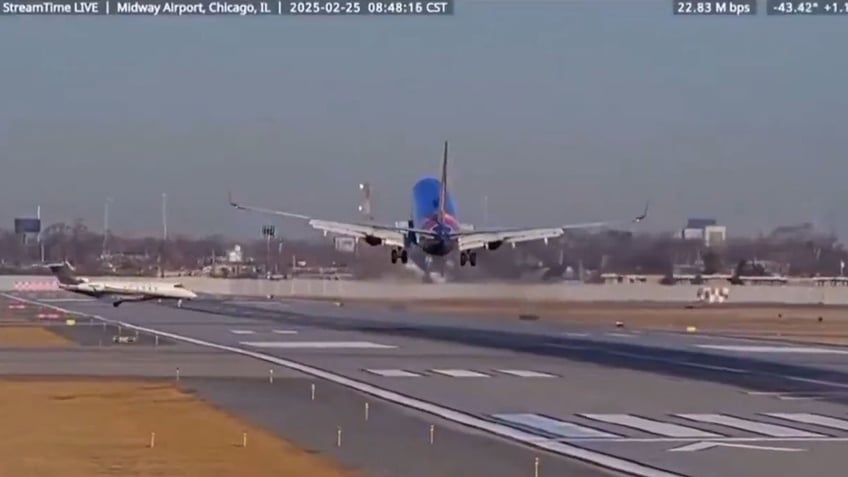 Southwest plane pulling up to avoid private jet