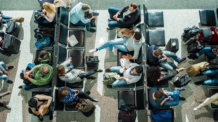 crowded boarding lounge in airport