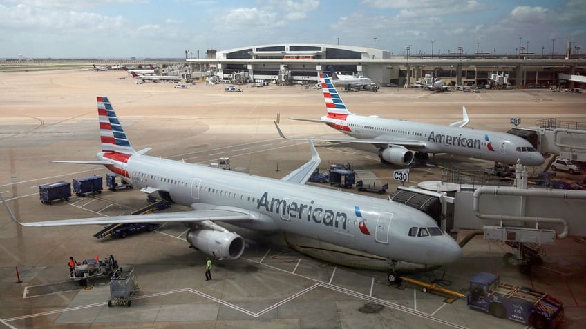 american airlines plane hits pickup truck while being towed for parking at boston airport