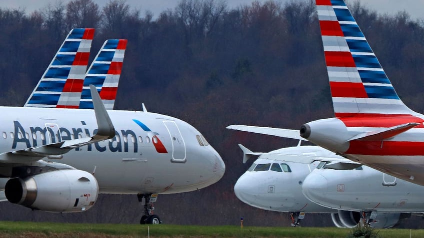 american airlines plane hits pickup truck while being towed for parking at boston airport