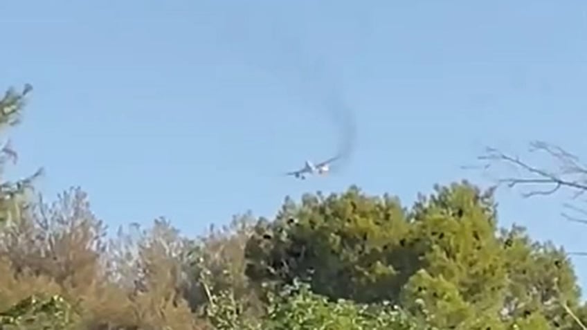 American Airlines midair with smoke coming for an engine