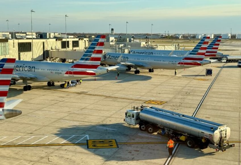 American Airlines projected a first-quarter loss but predicted improving travel demand wou