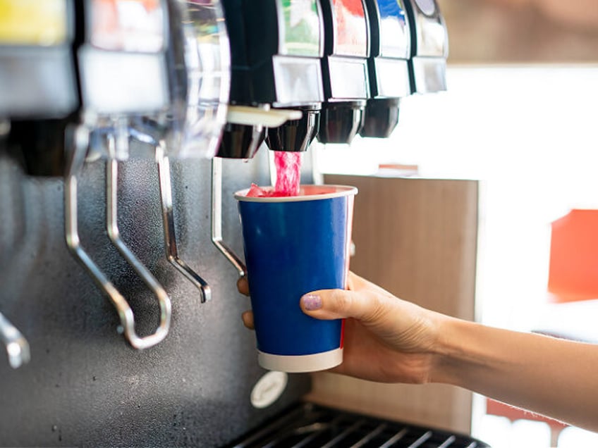 Man pours a fizzy drink.sparkling water.cool ice soft drink cola - stock photo