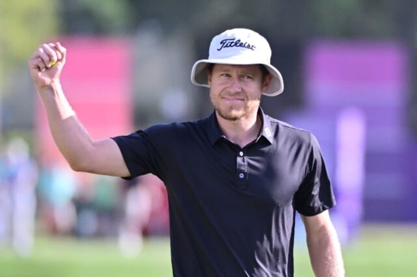 American Peter Malnati reacts to his birdie putt at the 17th hole to put him ahead to stay