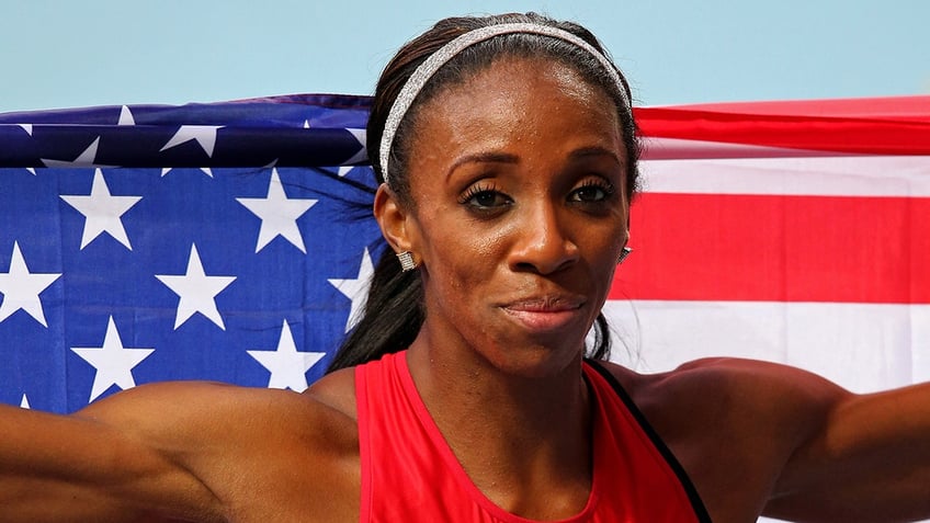 Lashinda Demus with the American flag